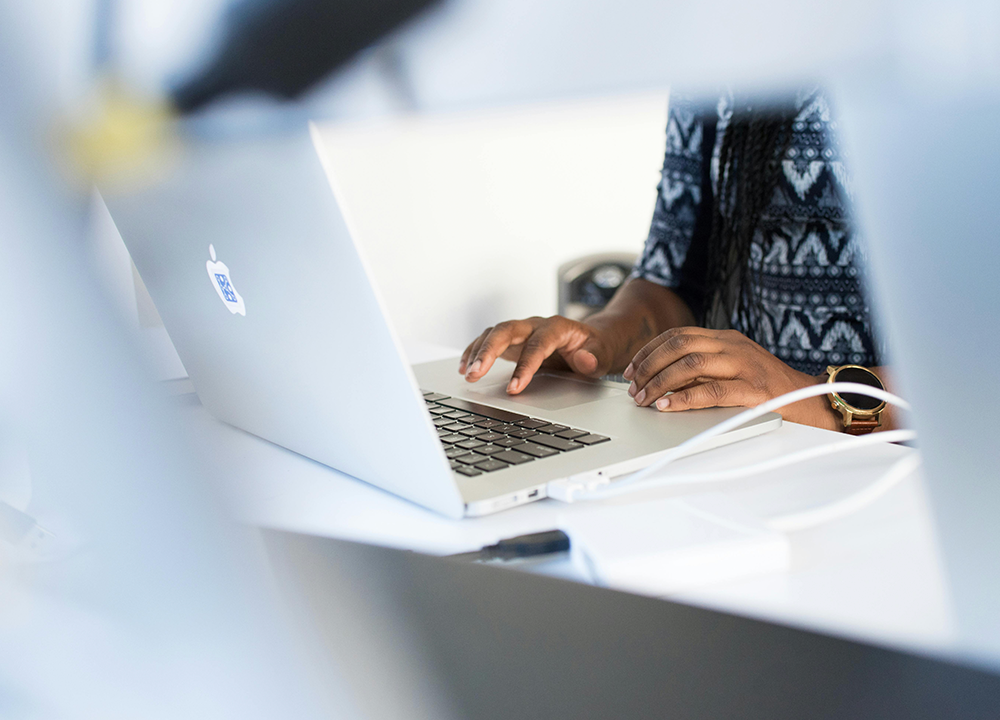 Woman sitting at laptop computer